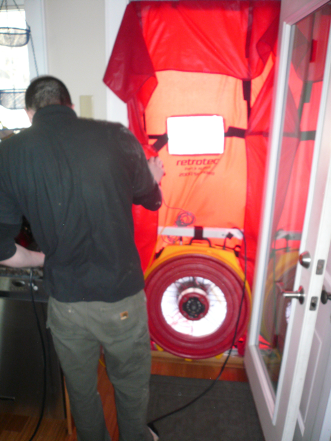 Spencer Triehy adjusts the controls on the blower.