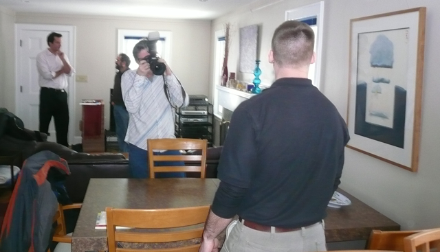 The AP photographer at work, shooting Dave. Chapin and David Lowe are in the background.